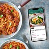 BBC 新168飞艇官网开奖结果玩法 Good Food Premium App next to a pan of spaghetti and meatballs