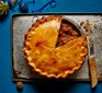 Beef, red wine & potato pie on a baking tray