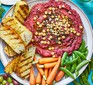 Beetroot hummus party platter served with vegetables and toast