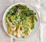 Braised spring onions on a plate