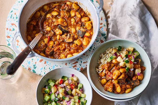 Butter bean curry in a saucepan and two bowls