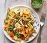 Carrot pilaf on a plate with coriander chutney alongside