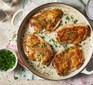 Chicken in white wine sauce in a baking dish