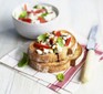 Open sandwich topped with cottage cheese, peppers and herbs.