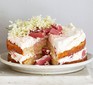 Rhubarb & elderflower cake served garnished with elderflowers on top