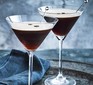 Espresso martinis in glasses with stirrers