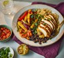 One fajita chicken rice bowl with burnt lime