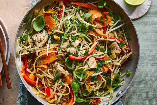 Healthy chicken pad Thai in a wok