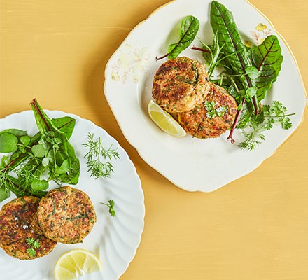 Jersey Royal crab cakes on plate with salad