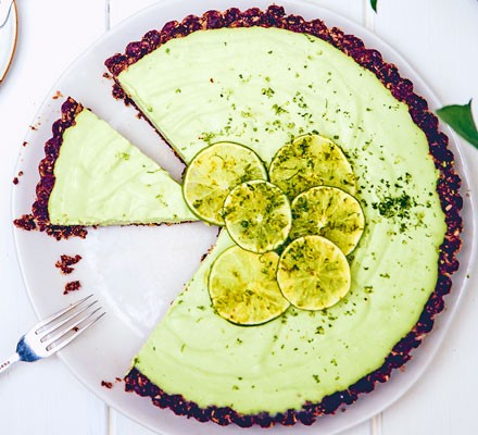 Vegan key lime pie with a slice taken