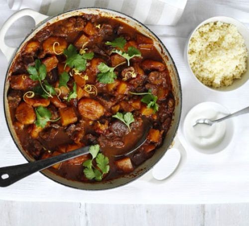 Lamb tagine in a pot, topped with herbs