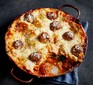 Three-cheese meatball lasagne served in a pan