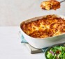 Nduja lasagne being served with a green salad