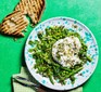 Pea, asparagus & burrata salad with mint salsa verde served on a plate