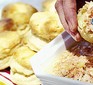 Buttermilk scones being spread with topping