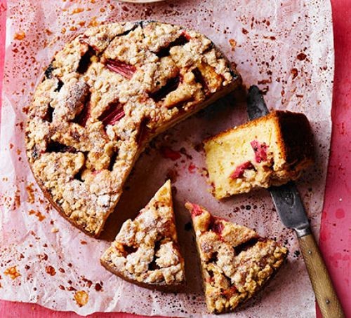 Rhubarb sponge cake in slices with knife