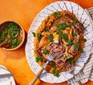 Slow-roasted mutton shoulder with garlic bean mash & gremolata served on a sharing plate