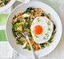 Spring green fried rice & eggs served on a plate