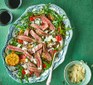 Steak tagliata with lemony lentils served on a decorative plate