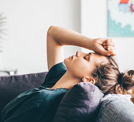 Stressed woman on the sofa