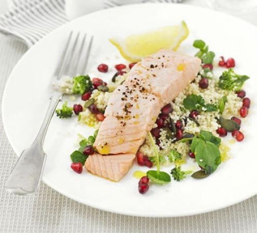 Salmon fillet on a bed of salad on a plate