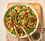 A bowl of tomato & black bean taco salad