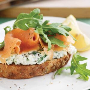 Wholegrain bread with herb cottage cheese, smoked salmon and rocket